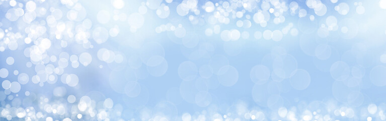 Artistic background with sunny bokeh. The basis for the design. Light blue background.