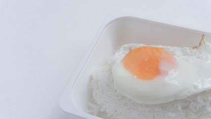 The inner box of rice is fried egg with white rice.