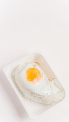 The inner box of rice is fried egg with white rice.