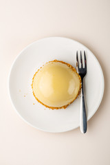 One cake on white plates top view