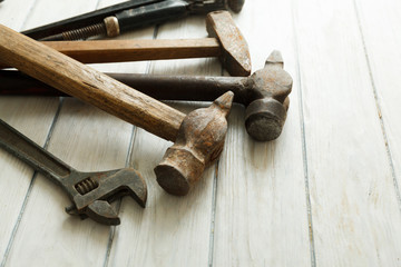 construction tools on wooden background with space for copy