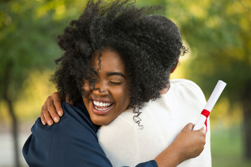 Mother and her daughter hugging at her graduation.