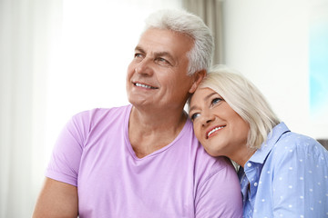 Portrait of happy senior couple at home