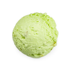 Scoop of delicious pistachio ice cream on white background, top view