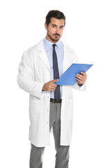 Young male doctor with clipboard on white background. Medical service