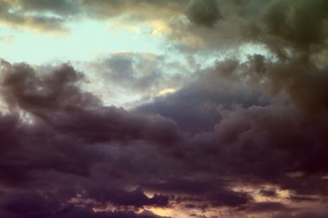 Obraz premium nice unreal toned fantasy sun colored clouds in the sky for using in design as background.