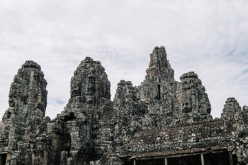 Large rocks carved in the shape of ancestral faces on the roof of Bayon Temple in Ankgor Thom, Cambodia - UNESCO World Heritage Site 1992