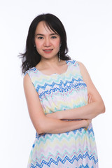 Portrait of happy asian woman over the white background.