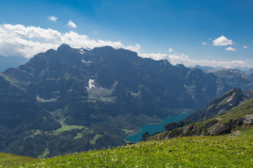 Fototapeta premium Glaernisch mountain, blue sky, lake Kloental in Switzerland