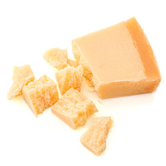 Pieces of parmesan cheese isolated on white background