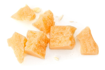 Pieces of parmesan cheese isolated on white background