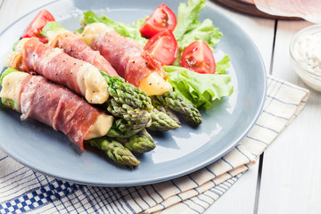 Baked prosciutto and cheese wrapped asparagus