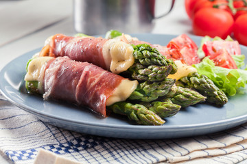 Baked prosciutto and cheese wrapped asparagus