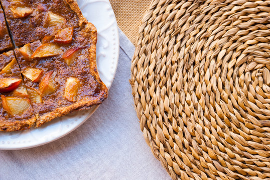 Vegetarian apple pearch cake with rustic background.
