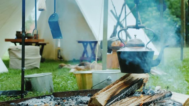 Food is cooked at the stake in a palatial campus in the forest.