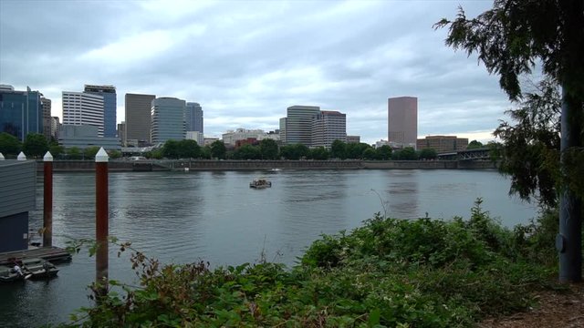 Tour boat traveling up the Willamette River from the Eastside Esplande in Portland Oregon