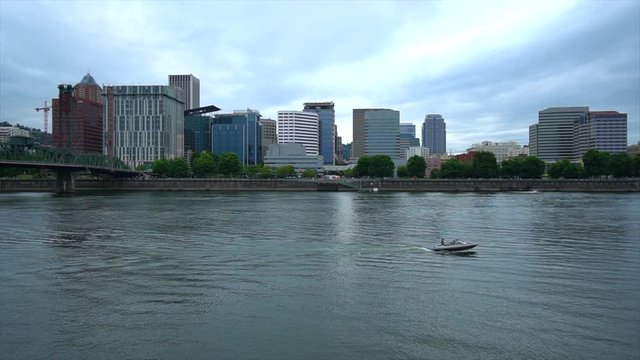 Boater enjoying the Willamette River and downtown Portland Oregon from the Eastside Esplanade