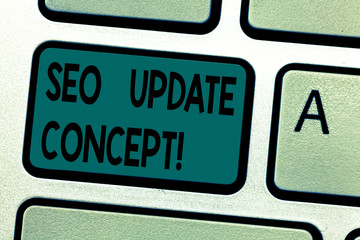 Fototapeta premium Text sign showing Seo Update Concept. Conceptual photo improve online visibility of website or page in engines Keyboard key Intention to create computer message pressing keypad idea