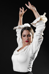 Flamenca medium shot performing with arms up