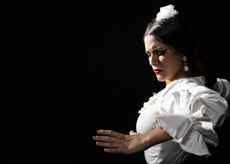 Lady looking down performing flamenco dance