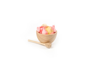 Pink rose flower in wood  bowl on white background.