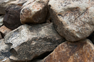 Fototapeta na wymiar Big and small stones. The mountains. The texture of the stone. Background