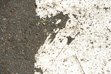 Old dirty asphalt texture with white paint on it. Top view
