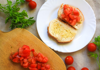 Breakfast, toast, tomatoes, cherry tomatoes and parsley, top view