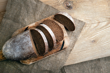 Freshly baked grain brown bread close up still life
