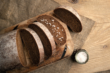 Freshly baked grain brown bread close up still life