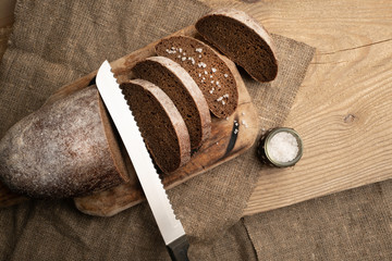 Freshly baked grain brown bread close up still life