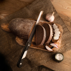 Freshly baked grain brown bread close up still life