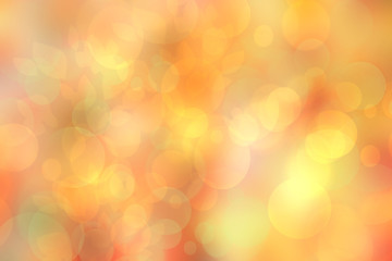 Fototapeta na wymiar A festive abstract golden yellow pink gradient background texture with glitter defocused sparkle bokeh circles. Card concept for Happy New Year, party invitation, valentine or other holidays.