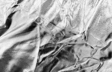 Crumpled silver material as abstract background