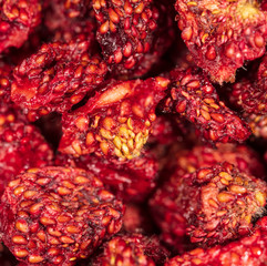 Red dried strawberries as background
