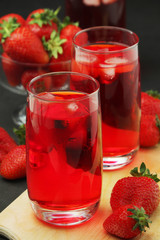 Glasses with strawberry drink with ice