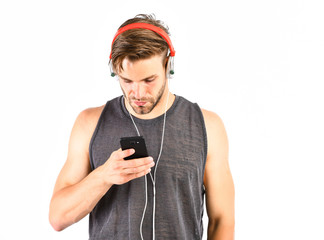 Man listen to music in headphones. unshaven man listening music in headset. sexy muscular man...