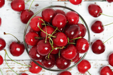 A small glass bowl with ripe fresh cherry