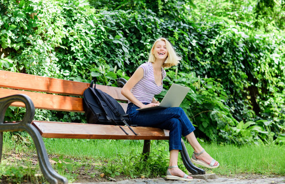 Study outdoors. Woman student work with notebook. Learn study explore. Modern student life. Regular student. Surfing internet. Girl adorable student with laptop and coffee cup sit bench in park