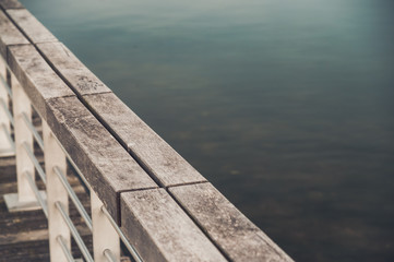 Rail on pier near the lake