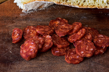 Sliced Raw Sausage on Wooden Cutting Board Ready to Eat/ Closeup still life food photography
