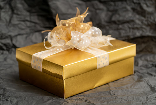 Gold Gift Box On Black Background