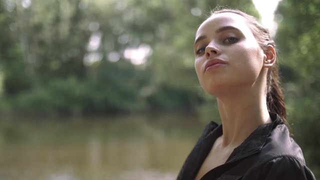Portrait of a beautiful young fitness model girl posing in a tracksuit