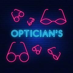 Neon lights store glasses. Bright advertising optics. Modern vector logo, banner, Board, picture labels of optics. Night advertising on the background of a brick wall.