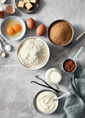 Baking ingredients: flour, eggs, sugar, butter, milk and spices