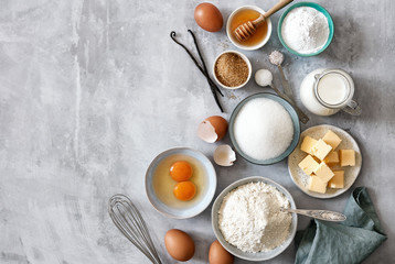 Fototapeta na wymiar Baking ingredients: flour, eggs, sugar, butter, milk and spices