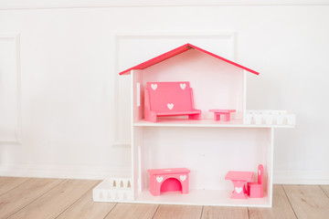 Doll houses in the children's room, furniture for children in the interior of the children's room