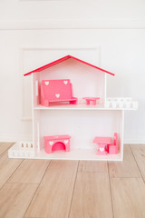 Doll houses in the children's room, furniture for children in the interior of the children's room