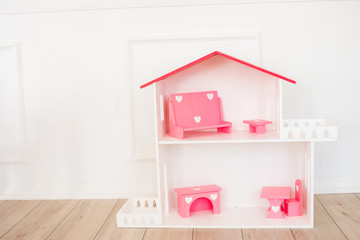 Doll houses in the children's room, furniture for children in the interior of the children's room