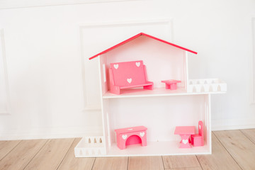 Doll houses in the children's room, furniture for children in the interior of the children's room